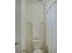 Bright bathroom featuring a toilet and shower with a clean, white shower curtain at 10029 Daufuskie Dr, Charlotte, NC 28278