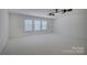 Spacious bonus room with lots of natural light and ceiling fan at 10029 Daufuskie Dr, Charlotte, NC 28278