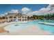 Resort-style community pool and lounge area with ample seating and sunny skies at 10029 Daufuskie Dr, Charlotte, NC 28278