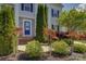 Close-up of the front entrance highlighting the blue door and meticulously maintained landscaping at 10029 Daufuskie Dr, Charlotte, NC 28278