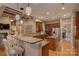 Large kitchen with a breakfast bar, ample counter space, and custom cabinetry at 10029 Daufuskie Dr, Charlotte, NC 28278