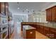 Gourmet kitchen with stainless steel appliances, granite countertops, and a central island at 10029 Daufuskie Dr, Charlotte, NC 28278