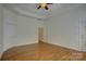 Spacious main bedroom with hardwood floors, and an ensuite bathroom at 10029 Daufuskie Dr, Charlotte, NC 28278