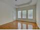 Bright room featuring hardwood floors, a large window, and a door to the outside at 10029 Daufuskie Dr, Charlotte, NC 28278