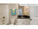 Clean bathroom with dark vanity, bathtub, and modern fixtures at 1005 Merganser Way, Indian Trail, NC 28079