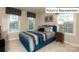 Bright bedroom with a teal bed frame and ample natural light at 1005 Merganser Way, Indian Trail, NC 28079