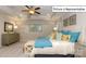 Main bedroom with large bed, dresser, and neutral color scheme at 1005 Merganser Way, Indian Trail, NC 28079