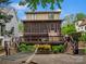Inviting backyard with a large wooden deck, screened porch, and relaxing hammock at 1655 Scotland Ave, Charlotte, NC 28207