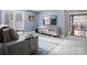 Stylish bedroom features a television, decorative wall accents, and comfortable seating at 1655 Scotland Ave, Charlotte, NC 28207
