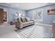 Comfortable bedroom with plush carpeting, a mirrored wall decor, and abundant natural light at 1655 Scotland Ave, Charlotte, NC 28207