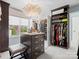 Spacious walk-in closet with custom storage solutions, ample natural light, and a stylish light fixture at 1655 Scotland Ave, Charlotte, NC 28207