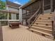 Entertainer's deck featuring a pool table, ample seating, and scenic views of the yard at 1655 Scotland Ave, Charlotte, NC 28207