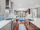 Gourmet kitchen features stainless steel appliances, bright countertops, and a seamless flow into the living space at 1655 Scotland Ave, Charlotte, NC 28207