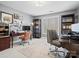 Spacious home office featuring two desks, built-in bookshelves, and large windows for natural light at 1655 Scotland Ave, Charlotte, NC 28207