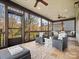 Inviting screened porch offers ample seating and scenic views, perfect for outdoor enjoyment at 1655 Scotland Ave, Charlotte, NC 28207