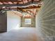 Unfinished basement with window and concrete floor at 2061 Gary Ln, Hickory, NC 28602