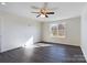 Well-lit bedroom with hardwood floors and a ceiling fan at 2061 Gary Ln, Hickory, NC 28602