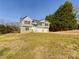 Two-story house with gray siding, stone accents, and a large yard at 2061 Gary Ln, Hickory, NC 28602