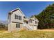 Two-story house with gray siding, stone accents, and a front porch at 2061 Gary Ln, Hickory, NC 28602