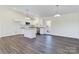 Open concept kitchen with island and hardwood floors at 2061 Gary Ln, Hickory, NC 28602