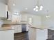 Eat-in kitchen with island, granite countertops, and white cabinets at 2061 Gary Ln, Hickory, NC 28602