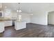 Open concept kitchen with island and hardwood floors at 2061 Gary Ln, Hickory, NC 28602
