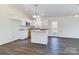 Open concept kitchen with island and hardwood floors at 2061 Gary Ln, Hickory, NC 28602