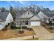 Inviting home featuring a well-manicured lawn, brick and siding exterior, and an attached garage at 2481 Bergamot St, Tega Cay, SC 29708