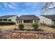 Fenced backyard featuring a screened patio, and garden area at 2481 Bergamot St, Tega Cay, SC 29708