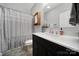 Stylish bathroom featuring a sleek black vanity, modern fixtures, and a shower with a curtain at 2481 Bergamot St, Tega Cay, SC 29708