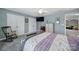 This pretty bedroom has a ceiling fan, large window, and soft colors creating a relaxing atmosphere at 2481 Bergamot St, Tega Cay, SC 29708