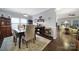 Bright dining room with hardwood floors and views into a living area, perfect for entertaining at 2481 Bergamot St, Tega Cay, SC 29708