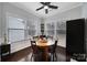 Cozy dining room area with hardwood floors, natural light, and modern ceiling fan is perfect for Gathering meals at 2481 Bergamot St, Tega Cay, SC 29708