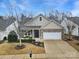Well-maintained two-story home with brick and siding, attached garage, and landscaped front yard at 2481 Bergamot St, Tega Cay, SC 29708