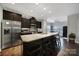 The kitchen features a large island, granite countertops, and stainless steel appliances perfect for cooking at 2481 Bergamot St, Tega Cay, SC 29708