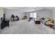 This large bonus room features neutral paint, carpet, ceiling fans and plenty of natural light at 2481 Bergamot St, Tega Cay, SC 29708