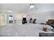 This large bonus room features neutral paint, carpet, ceiling fans and plenty of natural light at 2481 Bergamot St, Tega Cay, SC 29708