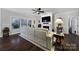 Bright living room featuring a fireplace and natural light that creates a warm and inviting atmosphere for relaxation at 2481 Bergamot St, Tega Cay, SC 29708