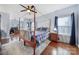 Spacious main bedroom with a four-poster bed, hardwood floors, and ample natural light at 2481 Bergamot St, Tega Cay, SC 29708