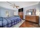 This primary bedroom features a four poster bed, TV, ceiling fan, and traditional style furniture at 2481 Bergamot St, Tega Cay, SC 29708