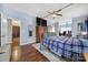 Elegant main bedroom with hardwood floors, TV, and access to a walk-in closet is the perfect owner's retreat at 2481 Bergamot St, Tega Cay, SC 29708