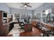 This sunny home office features built-in desk, great natural light, and rich hardwood floors at 2481 Bergamot St, Tega Cay, SC 29708