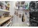Well-organized pantry with shelving, butcher block counter, and utility hooks for storing all your kitchen essentials at 2481 Bergamot St, Tega Cay, SC 29708