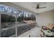 Screened porch with ceiling fan and an outside view at 2481 Bergamot St, Tega Cay, SC 29708