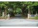 Community entrance with stone pillars and landscaping, creating a welcoming and elegant entry to the neighborhood at 2605 Willowdale Ln, Matthews, NC 28105