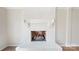 Close-up of a classic white brick fireplace with a hearth and mantel, adding character to the living space at 2605 Willowdale Ln, Matthews, NC 28105