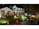 Festive home adorned with lights and decorations, perfect for celebrating the holidays at 2605 Willowdale Ln, Matthews, NC 28105