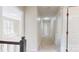 Upstairs hallway with carpet, neutral walls, and doors to bedrooms and bathrooms at 2605 Willowdale Ln, Matthews, NC 28105