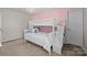 Charming bedroom with a built-in bunk bed and pink accent wall at 3032 Sterling Ct, Indian Land, SC 29707