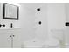 Modern bathroom with sleek fixtures, a tiled shower, and a pristine white vanity at 404 Morton St, Shelby, NC 28152